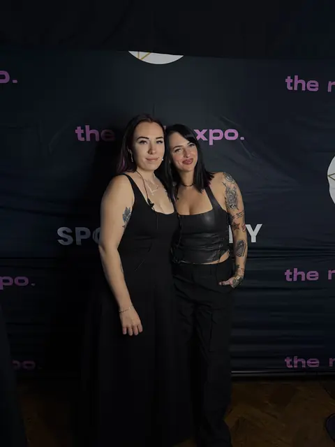 Two guests at the 2026 expo photo backdrop