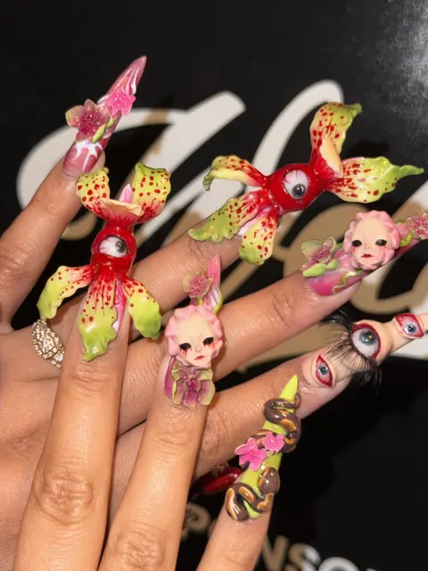 Intricate 3D nail art created by expo artists