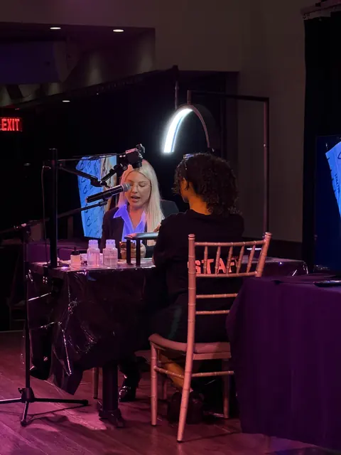 Artists demonstrating their techniques live on stage