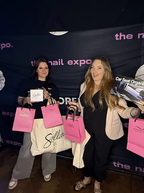 Attendees with their expo swag bags