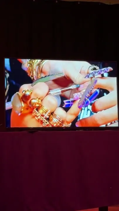 Nail art techniques shown on the stage screen