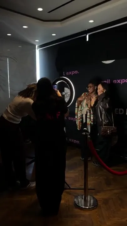 Guests arriving at the expo photo backdrop